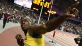 Jamaica's Usain Bolt reacts after winning the men's 100 meters race, August 5, 2012.