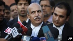 V.K. Anand, lawyer for one of the accused, speaks to journalists outside the Saket district court complex, where the five men facing charges of rape and murder of a 23-year-old woman last month, stand trial in New Delhi, Jan. 21, 2013.