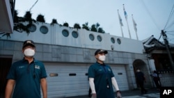 Police officers stand guard in front of the official residence of Seoul Mayor Park Won-soon in Seoul, South Korea, July 9, 2020. Police say Park has been reported missing and search operations are underway. 