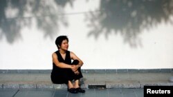 Filmmaker Tan Pin Pin poses during a 2007 photo shoot in Singapore. Her film, "To Singapore, with Love" was banned by the government in Singapore.