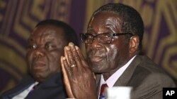 Zimbabwean Prime Minister Morgan Tsvangirai, left, and President Robert Mugabe, Harare, November 2011.