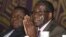 Zimbabwean Prime Minister Morgan Tsvangirai, left, and President Robert Mugabe, Harare, November 2011.