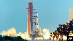 FILE - In this April 11, 1970, photo made available by NASA, the Saturn V rocket carrying the crew of the Apollo 13 mission to the moon launches from the Kennedy Space Center in Florida.