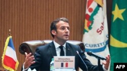 FILE - French President Emmanuel Macron speaks during the closing news conference at the G5 Sahel summit on June 30, 2020, in Nouakchott, Mauritania.