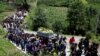 Procesión funeral por el menor de 13 años Pascual Melvin Guachiac, quien pereció sofocado en un camión en EEUU, en Nahualá, Guatemala, el 16 de julio de 2022.