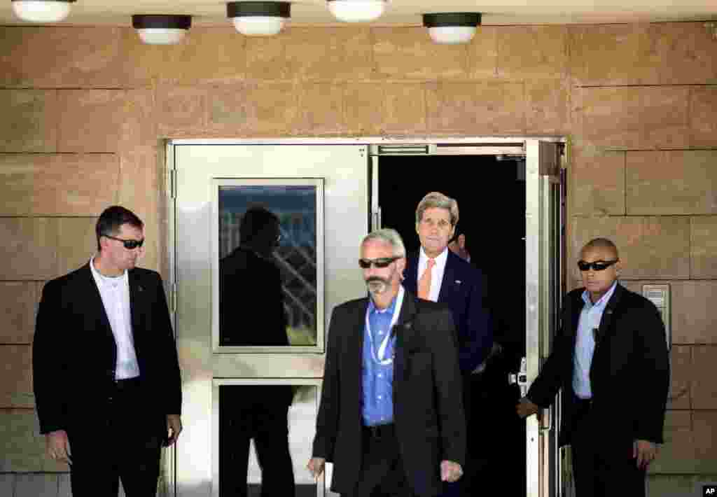 U.S. Secretary of State John Kerry leaves the U.S. embassy ahead of a meeting with Iraqi Prime Minister Nouri al-Maliki at his office in Baghdad, June 23, 2014. 