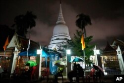 Locals wait in line overnight for free coronavirus testing at Wat Phra Si Mahathat temple in Bangkok, Thailand, Friday, July 9, 2021.