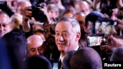 FILE - Benny Gantz, a former Israeli armed forces chief and head of the Israel Resilience party, arrives to deliver his first political speech at the party campaign launch in Tel Aviv, Israel, Jan. 29, 2019. 