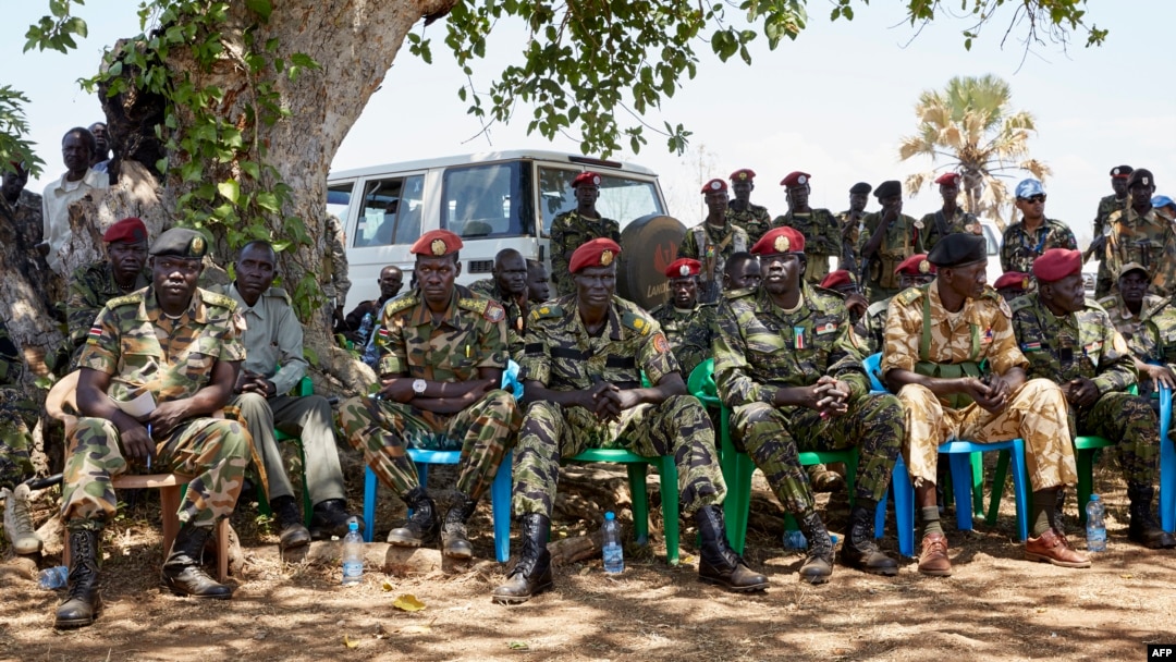 FILE - Members of the SSPDF special forces Tiger Batallion gather in Pageri, S. Sudan on Feb. 14, 2019. Members of SSPDF and their ex-rivals, SPLA-IO, gathered in Pageri to continue peace talks. 