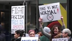 Protesters Hold Signs Outside Trump Towers in New York City