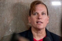 Former aide, Army Col. Kathryn Spletstoser, who has accused that Air Force Gen. John Hyten subjected her to a series of unwanted sexual advances, speaks to members of the media following Hyten's confirmation hearing, July 30, 2019.