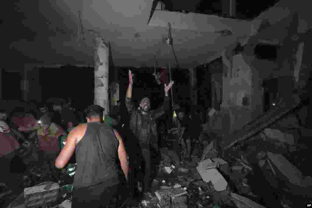 Palestinians search for survivors and bodies in the rubble of a mosque destroyed in an Israeli airstrike in Deir al-Balah, Oct. 6, 2024.