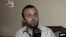 A picture grab taken on August 27, 2012 from the Syrian Al-Ikhbariya news channel shows Turkish journalist Cuneyt Unal, who has been missing in Syria for a week and reportedly being held by troops loyal to President Bashar al-Assad. 