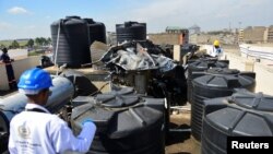 FILE - Fire following an explosion at a makeshift gas cylinder refilling depot at Mradi estate in Embakasi district of Nairobi, Kenya, February 2, 2024.