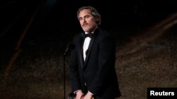 Joaquin Phoenix wins the Oscar for Best Actor in "Joker" at the 92nd Academy Awards in Los Angeles, Calif., Feb. 9, 2020. 