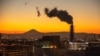 FILE - A chimney is seen at Japan's Keihin Industrial Zone as Mount Fuji looms in the background on Jan. 24, 2022. Japan set fresh climate targets on Feb.18, 2025, pledging to slash greenhouse gas emissions by 60% in fiscal 2035 from 2013 levels, the environment ministry said.