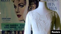 FILE - A mannequin is seen with a dress worn by Grace Kelly in the film "The Swan" in an exhibition of the late star's wardrobe at the Victoria and Albert Museum in London, April 15, 2010. 