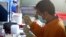 A staff member works on a blood sample of a chicken at the Veterinary Research Bureau, (File photo).