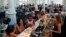 FILE - Crowds gather for Sunday brunch at the renovated St. Roch market in New Orleans, Aug. 16, 2015. After Hurricane Katrina, the city has been helped by billions of dollars in recovery money, buoyed by volunteers and the grit of its own citizens.