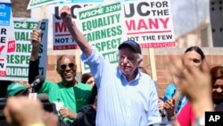 FILE - Vermont Sen. Bernie Sanders greets workers at a rally at the University of California Los Angeles, March 20, 2019. 