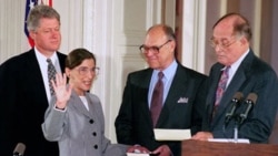 President Bill Clinton watches as Ruth Bader Ginsburg, his nominee for Supreme Court justice, takes the oath of office in 1993