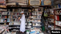 A man reads a book at a bookshop in Bab Doukkala in the city of Marrakech, Morocco, May 13, 2017. 
