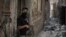 An Iraqi Special Forces soldier stands in a Mosul alley, July 7, 2017.