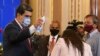 Venezuelan President Nicolás Maduro jokes with a journalist, spraying her with a disinfectant, at the end of a press conference in Caracas, Venezuela on December 8, 2020. (AP Photo/Matías Delacroix)