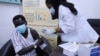 A health care worker administers a dose of the AstraZeneca COVID-19 vaccine, at Jabra Hospital in Khartoum, Sudan, March 11, 2021. 