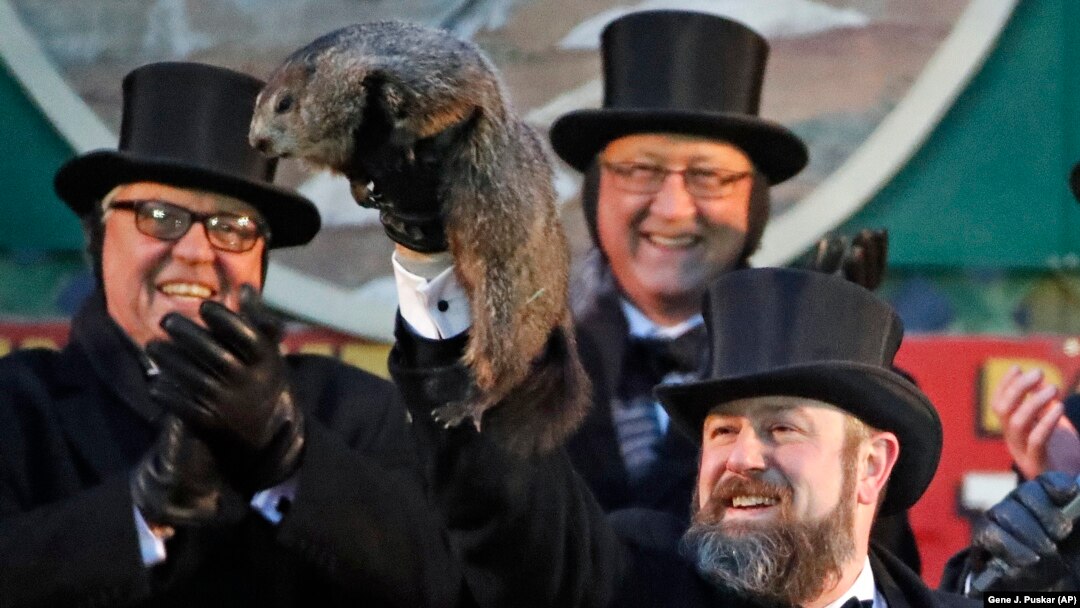 Groundhog Club co-handler Al Dereume holds Punxsutawney Phil, the weather prognosticating groundhog, during the 132nd celebration of Groundhog Day on Gobbler's Knob in Punxsutawney, Pa. Friday, Feb. 2, 2018. (Gene Puskar/AP)