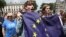 People hold flags during a 'March for Europe' demonstration against Britain's decision to leave the European Union, in central London, Britain, July 2, 2016. 