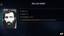 FILE - In this undated image released by the FBI, Mullah Omar is seen in a wanted poster. An Afghan official said his government is examining claims that reclusive Taliban leader Mullah Omar is dead. 