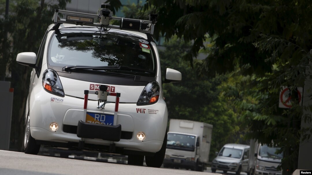 An autonomous self-driving vehicle goes onto the road during a demonstration at one-north business park in Singapore October 12, 2015.