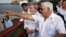 FILE - Panama's President Ricardo Martinelli (left) shows Brazil's former President Luiz Inacio Lula da Silva (second from right) an extension of the coastal strip build by Brazilian company Norberto Odebrecht in Panama City, May 20, 2011.