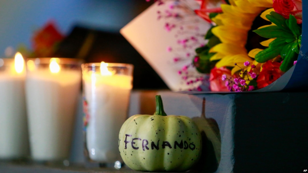 FILE - Flowers and candles adorn a statue honoring the late former Los Angeles Dodgers pitcher Fernando Valenzuela outside the Pan-American stadium in Guadalajara, Mexico, Oct. 23, 2024. Valenzuela died the previous day at age 63.