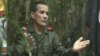 FILE - National Liberation Army (ELN) commander Nicolas Rodriguez, known as "Gabino," gestures as he speaks in response to questions from Reuters at a hidden jungle camp in this still image taken from an undated video released August 27, 2012.