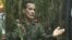 FILE - National Liberation Army (ELN) commander Nicolas Rodriguez, known as "Gabino," gestures as he speaks in response to questions from Reuters at a hidden jungle camp in this still image taken from an undated video released August 27, 2012.