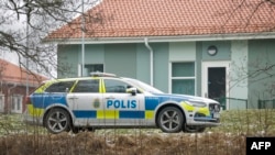 A police vehicle is seen near a Campus Risbergska building in Orebro, Sweden, on Feb. 4, 2025. Five people were shot at the school, police said. (TT news agency via AFP)