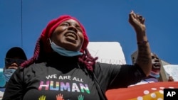 FILE - Members of Kenya's LGBTQ community, and their supporters, protest against recent comments made by Kenya's Cabinet Secretary for Education George Magoha, at a demonstration in downtown Nairobi, Kenya Thursday, Jan. 13, 2022.