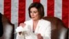 House Speaker Nancy Pelosi of Calif., tears her copy of President Donald Trump's State of the Union address after he delivered it to a joint session of Congress in Washington, Feb. 4, 2020.