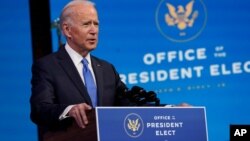 FILE - President-elect Joe Biden speaks after the Electoral College formally confirmed his election win, at The Queen theater in Wilmington, Delaware, Dec. 14, 2020. 