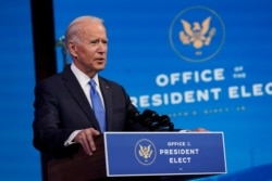 FILE - President-elect Joe Biden speaks after the Electoral College formally confirmed his election win, at The Queen theater in Wilmington, Delaware, Dec. 14, 2020.