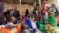Internally displaced Somali women wait for medicine at a Save the Children UK clinic at their camp in Hodan district of Somalia's capital Mogadishu, Nov. 21, 2012. 