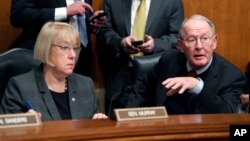 FILE - Senate Health, Education, Labor, and Pensions Committee Chairman Lamar Alexander, R-Tenn., accompanied by the committee's ranking member Sen. Patty Murray, D-Wash., speaks on Capitol Hill in Washington, Jan. 31, 2017.