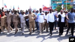 FILE - The party's deputy chairman, Tundu Lissu, front center, and supporters of Tanzania's main opposition party, Chadema, protest in Dar es Salaam, Tanzania, Wednesday, Jan. 24, 2024.