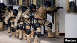 Participants of the European Union Force, Armed Forces, Border Police and State Investigation and Protection Agency of Bosnia and Herzegovina practice an anti-terrorism situation during an exercise at the Sarajevo International Airport.