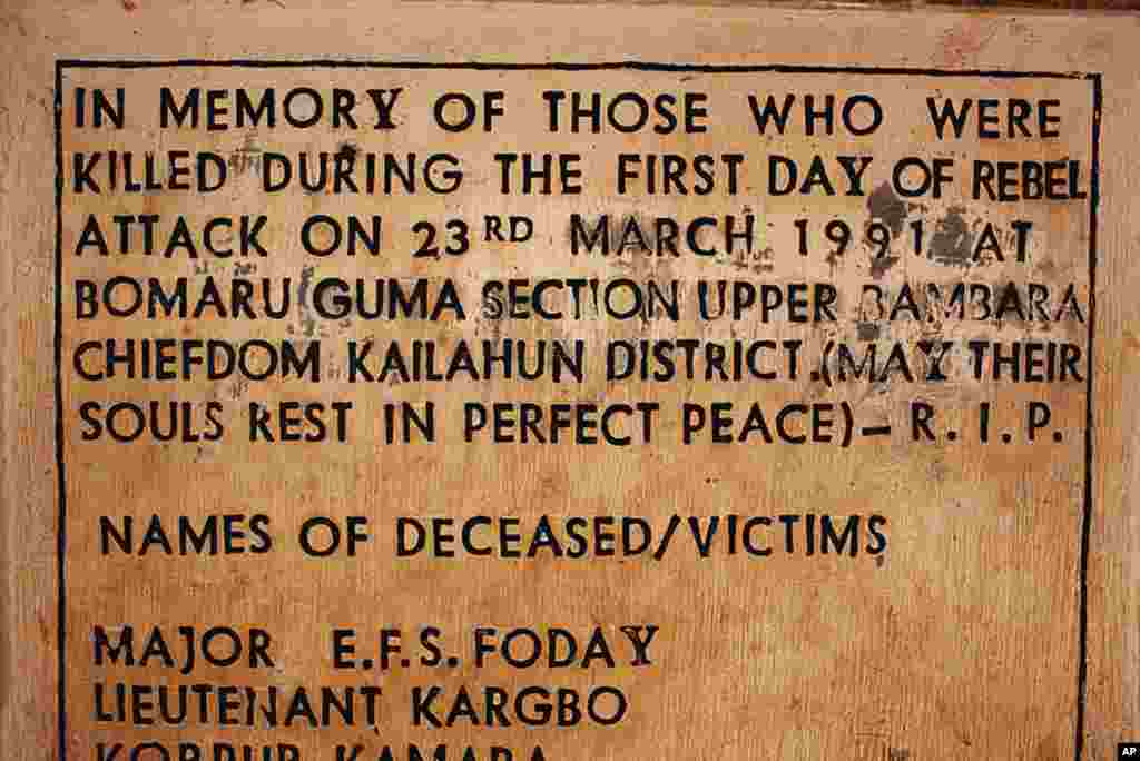 A sign commemorating the start of the civil war is displayed at a memorial site where the conflict began, in the village of Bomaru, eastern Sierra Leone April 22, 2012. (Reuters)