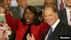 Supporters of Democratic Alabama U.S. Senate candidate Doug Jones celebrate at the election night party in Birmingham, Alabama, U.S., Dec. 12, 2017.