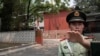 A paramilitary police officer outside the Belgium embassy in Beijing, June 19, 2019. A Belgian diplomat was to travel to China's Xinjiang region to confirm the whereabouts of a Uighur family escorted from the embassy in Beijing by police last month.