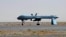 Un drone sans pilote américain Predator, armé d’un missile, est posé sur le tarmac de l’aéroport militaire de Kandahar, en Afghanistan, le 13 juin 2010.